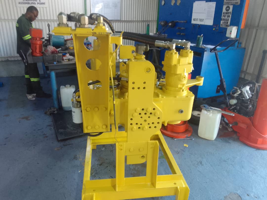 1192892492-IMG-20220809-WA0023 Yellow hydraulic machinery being assembled, a key part of hydraulic and mechanical engineering services.