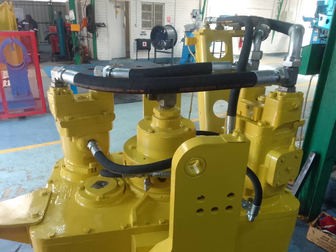 1195663055-IMG-20220809-WA0026 Yellow hydraulic machinery with hoses, used in hydraulic and mechanical engineering services.