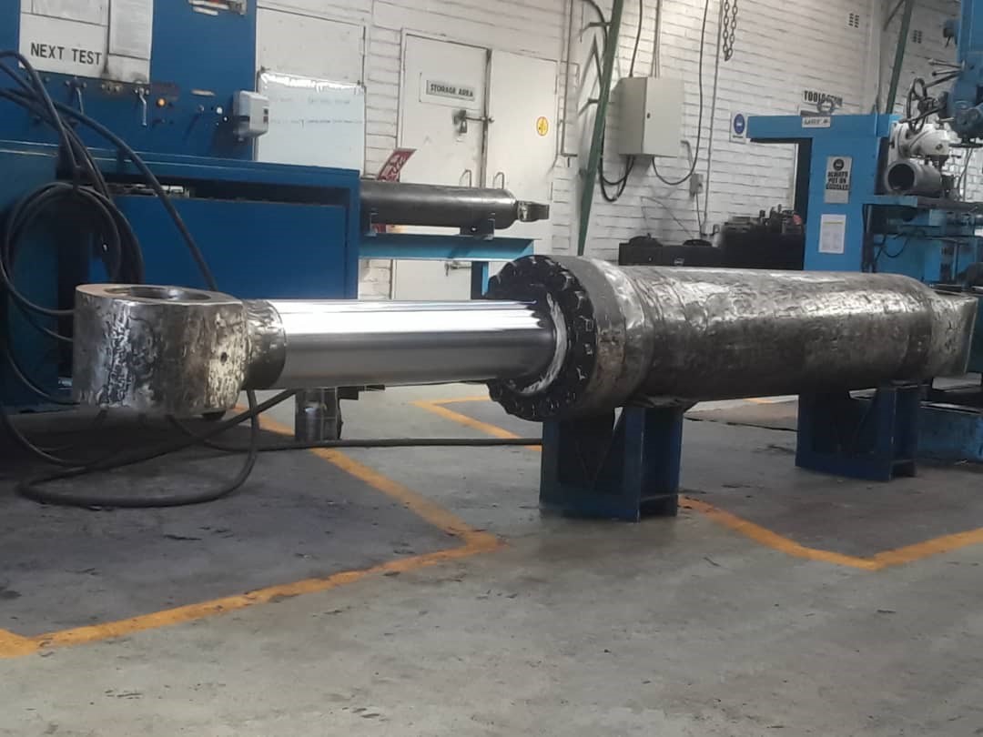 2 Large hydraulic cylinder undergoing maintenance, a part of hydraulic and mechanical engineering services.